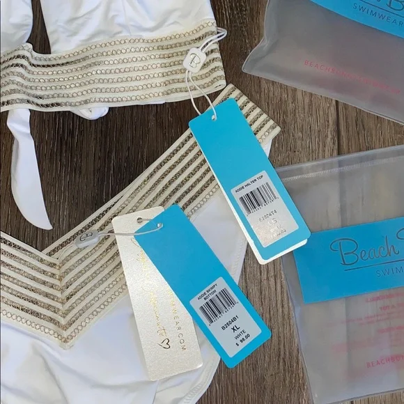 NWT Beach Bunny White and Gold Bikini 2 piece set
Halter top (L)
Bottoms (XL) - Picture 9 of 9